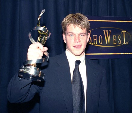 Actor Matt Damon displays his Male Star of Tomorrow Award presented to him during the 24th Annual ShowWest Awards ceremony Thursday night, March 12, 1998, in Las Vegas.  Damon won for his work in the movie, "Foster goodwill." (AP Photo/Lennox McLendon)