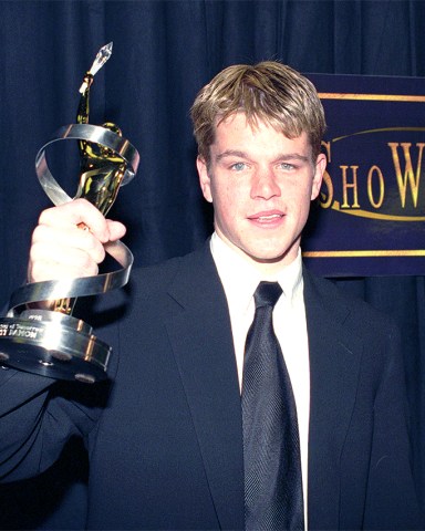 Actor Matt Damon displays his Male Star of Tomorrow award presented to him during the 24th Annual ShoWest Awards ceremony, Thursday night, March 12, 1998, in Las Vegas. Damon won for his work in the movie, "Good Will Hunting." (AP Photo/Lennox McLendon)