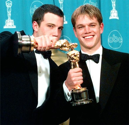 FILE - In this March 23, 1998 file photo, Ben Affleck, left, and Matt Damon display their Oscars for best original screenplay. "goodwill,"at the 70th Academy Awards at the Shrine Auditorium in Los Angeles.  (AP Photo/Reed Saxon, File)