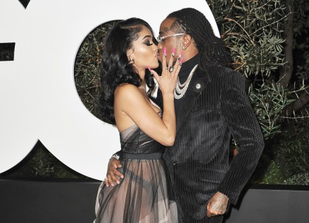 Saweetie, left, and Quavo kiss as they arrive at GQ's Men of the Year Celebration on Thursday, Dec. 5, 2019, in West Hollywood, Calif. (Photo by Richard Shotwell/Invision/AP)