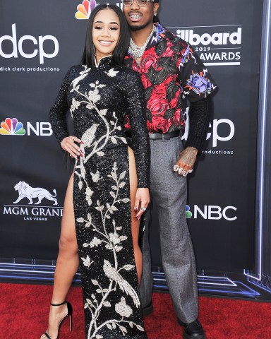 Saweetie, left, and Quavo arrive at the Billboard Music Awards on Wednesday, May 1, 2019, at the MGM Grand Garden Arena in Las Vegas. (Photo by Richard Shotwell/Invision/AP)