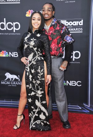 Saweetie, left, and Quavo arrive at the Billboard Music Awards on Wednesday, May 1, 2019, at the MGM Grand Garden Arena in Las Vegas. (Photo by Richard Shotwell/Invision/AP)