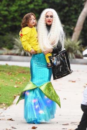 Los Angeles, CA  - *EXCLUSIVE*  - Singer and TV host Gwen Stefani dressed as a mermaid for Halloween and revealed a distinct stomach bump in her tight outfit. Her father also joined her to help her with her children. Apollo was dressed as Pikachu and Zuma was dressed as an even larger, inflatable Pikachu while Kingston sported a more classic Halloween look. Shot on 11/01/17

Pictured: Gwen Stefani, Apollo Rossdale

BACKGRID USA 1 NOVEMBER 2017 

USA: +1 310 798 9111 / usasales@backgrid.com

UK: +44 208 344 2007 / uksales@backgrid.com

*UK Clients - Pictures Containing Children
Please Pixelate Face Prior To Publication*