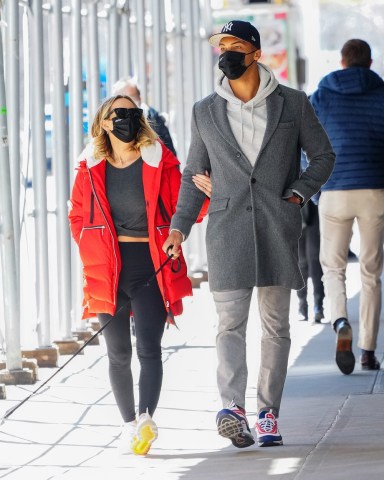 New York, NY  - *EXCLUSIVE*  - Are they headed down the aisle finally?
Dale Moss and Clare Crawley are spotted taking her dog for a walk in sunny spring New York after coming back from her birthday trip in Napa, CA. The couple who split briefly appear to be going stronger than ever and Clare could be seen sporting what appears to be a new sparkler on THAT finger again. Dale proposed with a  stunning 4.5-carat sparkler from Neil Lane originally and though the ring has been off for some time, it appears it may have been replaced by a new diamond! **Shot on March 30, 2021**

Pictured: Dale Moss, Clare Crawley

BACKGRID USA 31 MARCH 2021 

USA: +1 310 798 9111 / usasales@backgrid.com

UK: +44 208 344 2007 / uksales@backgrid.com

*UK Clients - Pictures Containing Children
Please Pixelate Face Prior To Publication*