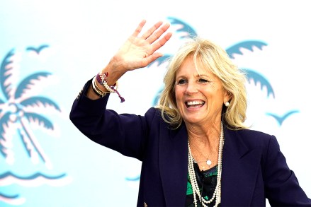 Jill Biden waves to supporters while campaigning for her husband Democratic presidential candidate and former Vice President Joe Biden, during a drive in rally Sunday, Nov. 1, 2020, in Tampa, Fla. (AP Photo/Chris O'Meara)