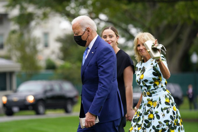 Jill Biden waves while walking with Joe and Naomi