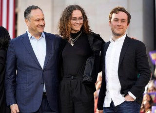 Douglas Emhoff, left, husband of U.S. Sen. Kamala Harris, D-California, and children Ella and Cole, stand on stage after Harris launched her presidential campaign at a rally in her hometown of Oakland, Calif., Sunday, Jan. 27, 2019. (AP Photo/Tony Avelar)