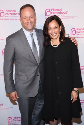 IMAGE DISTRIBUTED FOR PLANNED PARENTHOOD ADVOCACY PROJECT -Champion of Choice California Attorney General Kamala Harris, right, and her husband, Douglas Emhoff, pose together at the Planned Parenthood Advocacy Project's "Politics, Sex, & Cocktails" at Spectra by Wolfgang Puck on Thursday, Oct. 2, 2014 in West Hollywood, Calif. (Photo by Matt Sayles/Invision for Planned Parenthood Advocacy Project/AP Images)