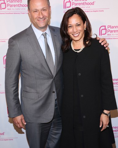 IMAGE DISTRIBUTED FOR PLANNED PARENTHOOD ADVOCACY PROJECT -Champion of Choice California Attorney General Kamala Harris, right, and her husband, Douglas Emhoff, pose together at the Planned Parenthood Advocacy Project's "Politics, Sex, & Cocktails" at Spectra by Wolfgang Puck on Thursday, Oct. 2, 2014 in West Hollywood, Calif. (Photo by Matt Sayles/Invision for Planned Parenthood Advocacy Project/AP Images)