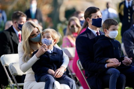 Ivanka Trump, Assistant to the President and Advisor to the President, left, and her husband, Jared Kushner, Assistant to the President and Senior Advisor, with their children, are seated to watch President Donald Trump pardon the national Thanksgiving turkey, in the Rose Garden of the White House, Tuesday, Nov. 24, 2020, in Washington. (AP Photo/Susan Walsh)