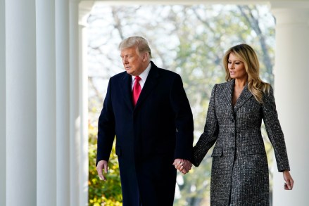President Donald Trump walks out to pardon the national Thanksgiving turkey, in the Rose Garden of the White House, Tuesday, Nov. 24, 2020, in Washington, with first lady Melania Trump. (AP Photo/Susan Walsh)
