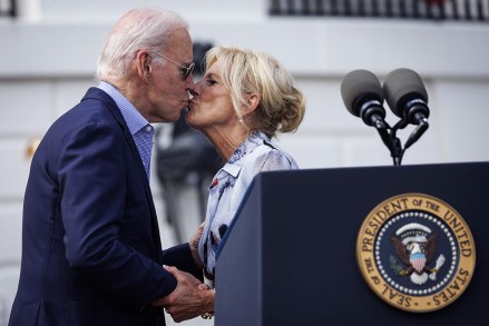 US President Joe Biden and First Lady Jill Biden share a kiss during a Fourth of July event on the South Lawn of the White House in Washington, DC, on Tuesday, July 4, 2023. Biden is hosting the event for military and veteran families, caregivers, and survivors to celebrate Independence Day.
White House Fourth Of July Event - Washington, United States - 04 Jul 2023