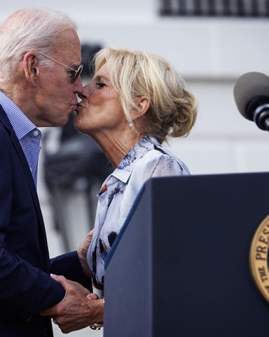 US President Joe Biden and First Lady Jill Biden share a kiss during a Fourth of July event on the South Lawn of the White House in Washington, DC, on Tuesday, July 4, 2023. Biden is hosting the event for military and veteran families, caregivers, and survivors to celebrate Independence Day.
White House Fourth Of July Event - Washington, United States - 04 Jul 2023