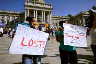 People celebrate outside the Pennsylvania State Capitol, Saturday, Nov. 7, 2020, in Harrisburg, Pa., after Democrat Joe Biden defeated President Donald Trump to become 46th president of the United States. (AP Photo/Julio Cortez)