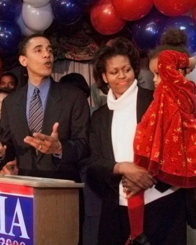 Barack Obama, District One Democratic candidate for Congress, delivers his concession speech to supporters while his wife Michelle tends to their daughter Malia during a post-primary function Tuesday, March 21, 2000, in Chicago. Incumbent Congressman Bobby Rush won the Democratic nomination. (AP Photo/Frank Polich)