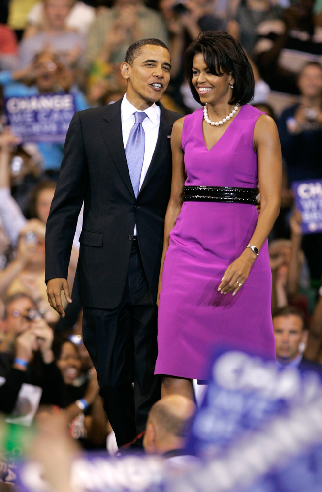 Barack and Michelle Obama take the stage for a speech in 2008