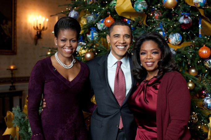 Barack and Michelle Obama pose with pal Oprah Winfrey