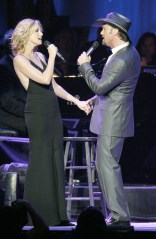 Faith Hill and Tim McGraw perform during the Andre Agassi Charitable Foundation's Grand Slam for Children at MGM Grand Hotel and Casino Saturday, Oct. 2, 2004. Proceeds  go to benefit underprivileged, abused and abandoned children. (AP Photo/Matthew Minard)