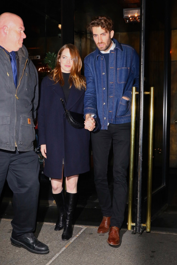 Emma Stone cradles baby bump as pregnancy is revealed