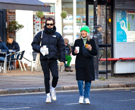 EXCLUSIVE: Harry Styles seen out with pretty blonde Ellis Calcuty whom he has been rumoured to have dated when he was younger. Harry was seen with facial hair/mustache and with his hair up in a hair clip while wearing ladies sunglasses, he wore The North Face coat old sneakers and white socks with his pants tucked into them. The couple enjoyed a coffee and a snack on a walk in London's Hampstead heath. 24 Jan 2023 Pictured: Harry Styles Ellis Calcuty. Photo credit: MEGA TheMegaAgency.com +1 888 505 6342 (Mega Agency TagID: MEGA936077_022.jpg) [Photo via Mega Agency]