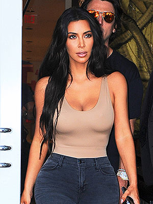 Kim Kardashian Shows Off Black Bodysuite & Heels In New SKIMS Pic
