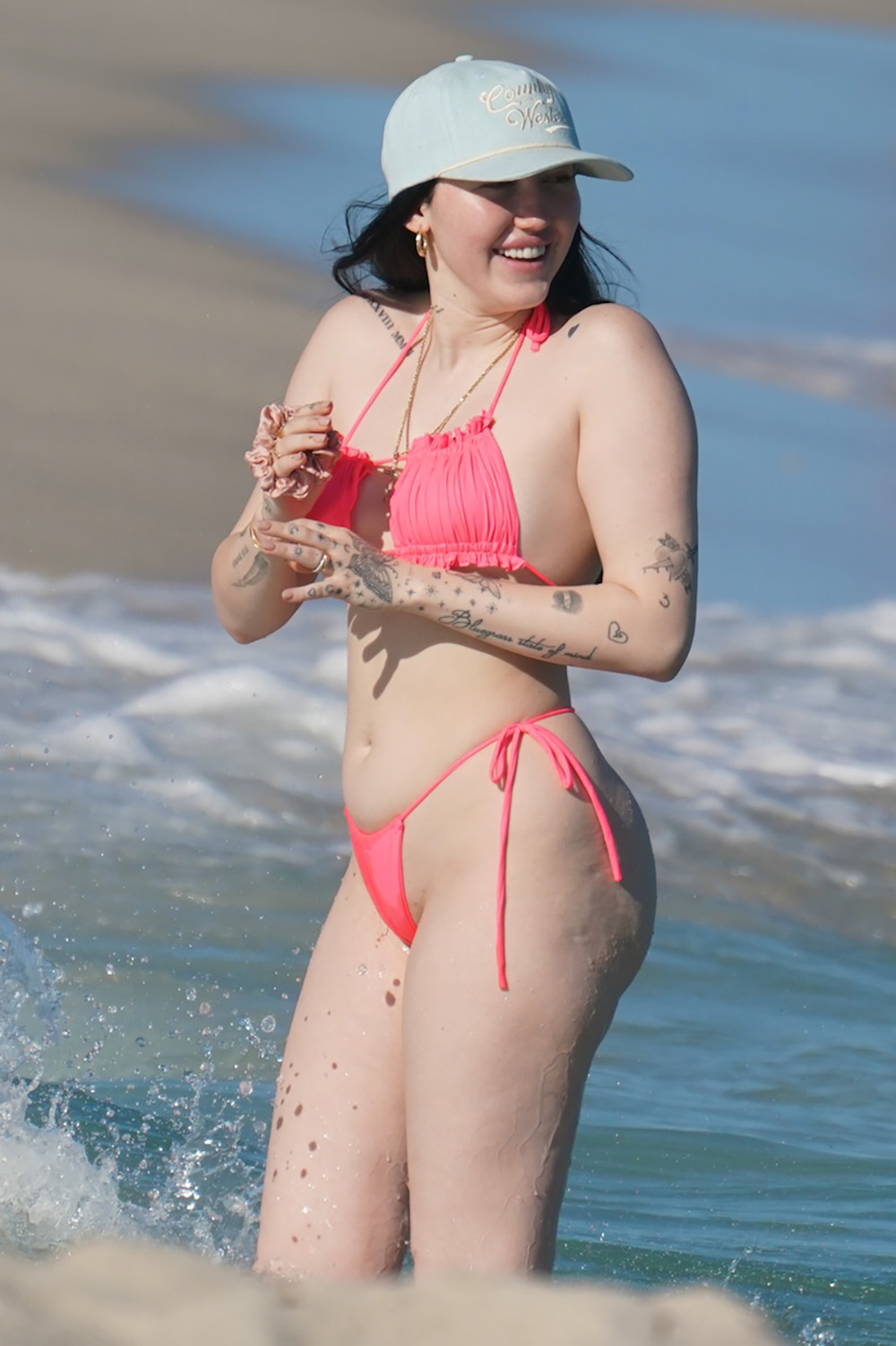 Noah Cyrus wears a neon pink bikini to the beach in Miami