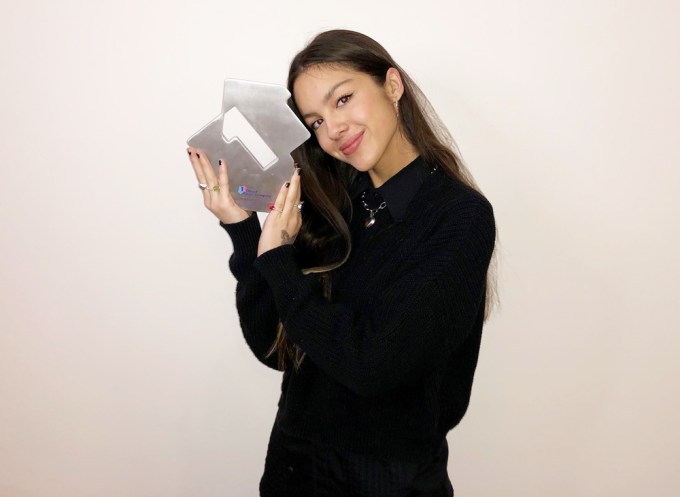 Olivia Rodrigo With Her Number 1 Award