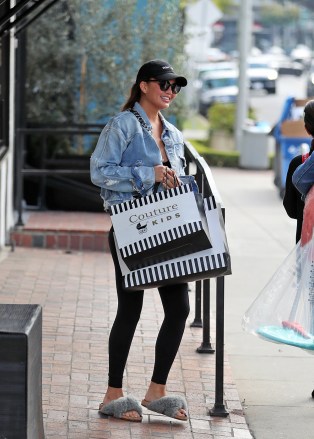 Chrissy Teigen is all smiles in denim jacket and black tights while she is seen shopping for baby Miles at Couture Kids On Robertson West Hollywood.Pictured: Chrissy TeigenRef: SPL5141658 200120 NON-EXCLUSIVEPicture by: SplashNews.comSplash News and PicturesUSA: +1 310-525-5808London: +44 (0)20 8126 1009Berlin: +49 175 3764 166photodesk@splashnews.comWorld Rights