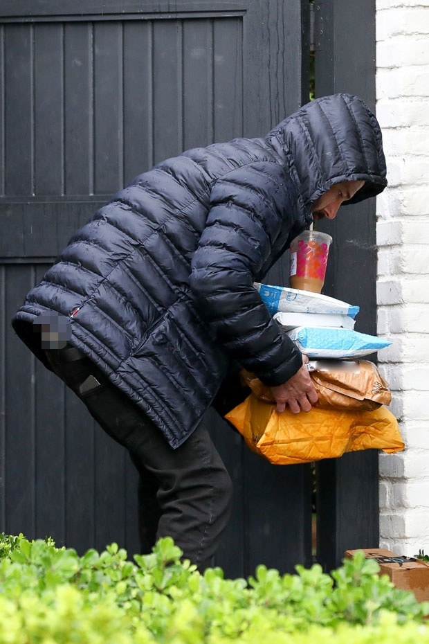Ben Affleck's Pants Start Falling While He Holds Packages & Coffee