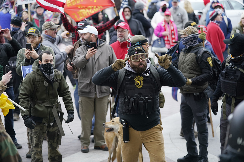 Trump supporters gather outside the Capitol, Wednesday, Jan. 6, 2021, in Washington. As Congress prepares to affirm President-elect Joe Biden's victory, thousands of people have gathered to show their support for President Donald Trump and his claims of election fraud. (AP Photo/Manuel Balce Ceneta)