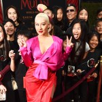 Singer Christina Aguilera poses with fans at the premiere of the film "Mulan" at the El Capitan Theatre, Monday, March 9, 2020, in Los Angeles. (AP Photo/Chris Pizzello)