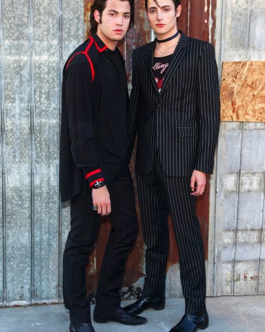 Peter Brant, left, and Harry Brant, right, attend the New York Fashion Week Spring/Summer 2016 Givenchy fashion show on Friday, Sept. 11, 2015, in New York. (Photo by Andy Kropa/Invision/AP)