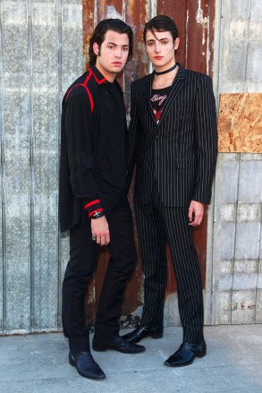 Peter Brant, left, and Harry Brant, right, attend the New York Fashion Week Spring/Summer 2016 Givenchy fashion show on Friday, Sept. 11, 2015, in New York. (Photo by Andy Kropa/Invision/AP)