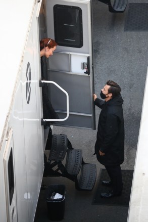 **FILE PHOTOS** Los Angeles, CA  - Harry Styles is seen visiting fellow cast member Olivia Wilde's trailer on November 3, 2020 on the set of "Don't Worry Darling". Harry appeared to put a big smile on Olivia's face as the two costars chatted on the set.  Harry and Olivia are now officially a new couple after being spotted holding hands this weekend as they attended a friend's wedding together.Pictured: Olivia Wide, Harry StylesBACKGRID USA 4 JANUARY 2021 USA: +1 310 798 9111 / usasales@backgrid.comUK: +44 208 344 2007 / uksales@backgrid.com*UK Clients - Pictures Containing ChildrenPlease Pixelate Face Prior To Publication*