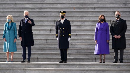 President Joe Biden his wife Jill Biden and Vice President Kamala Harris her husband Doug Emhoff watch a military pass in review ceremony on the East Front of the Capitol at the conclusion of the inauguration ceremonies, in Washington, Wednesday, Jan. 20, 2021. (AP Photo/J. Scott Applewhite)