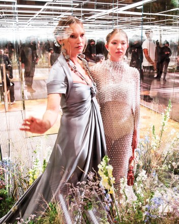 Model Kate Moss, left, and her daughter Lila Grace Moss wear creations for Fendi's Spring-Summer 2021 Haute Couture fashion collection presented Wednesday, Jan.27, 2021 in Paris. (AP Photo/Francois Mori)