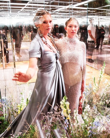 Model Kate Moss, left, and her daughter Lila Grace Moss wear creations for Fendi's Spring-Summer 2021 Haute Couture fashion collection presented Wednesday, Jan.27, 2021 in Paris. (AP Photo/Francois Mori)
