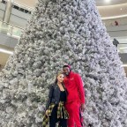 EXCLUSIVE: New couple Larsa Pippen and Malik Beasley get in the festive spirit as they pose in front of a giant Christmas tree in his hometown of Minnesota
