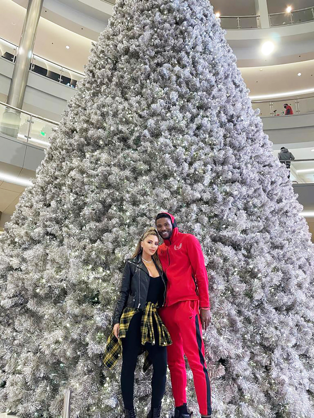 EXCLUSIVE: New couple Larsa Pippen and Malik Beasley get in the festive spirit as they pose in front of a giant Christmas tree in his hometown of Minnesota