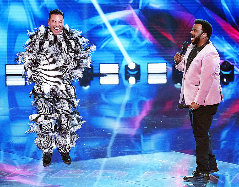 THE MASKED DANCER: L-R: Oscar De La Hoya and host Craig Robinson  in the “Semi Finals - It’s All About The Dance” episode of THE MASKED DANCER airing Wednesday, Feb. 10 (8:00-9:00 PM ET/PT) on FOX. CR: Michael Becker/ FOX. © 2021 FOX MEDIA LLC.