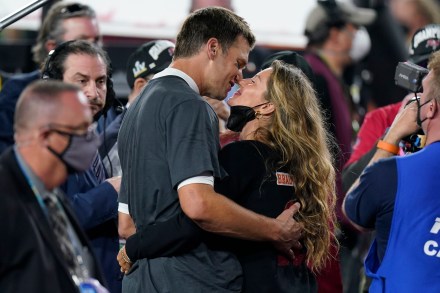 Tampa Bay Buccaneers quarterback Tom Brady kisses wife Gisele Bundchen after defeating the Kansas City Chiefs in the NFL Super Bowl 55 football game Sunday, Feb. 7, 2021, in Tampa, Fla. The Buccaneers defeated the Chiefs 31-9 to win the Super Bowl. (AP Photo/Mark Humphrey)