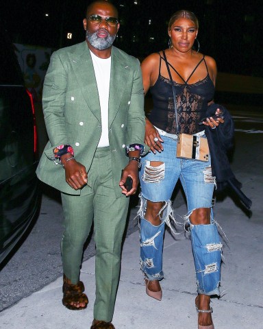 Miami, FL  - *EXCLUSIVE*  - NeNe Leakes and her boyfriend Nyonisela Sioh were seen arriving at Bar One restaurant for a dinner in Miami, Florida. NeNe looks casually chic in a lace body suit and baggy ripped jeans paired with heels.  Pictured: NeNe Leakes, Nyonisela Sioh  BACKGRID USA 9 MAY 2022   USA: +1 310 798 9111 / usasales@backgrid.com  UK: +44 208 344 2007 / uksales@backgrid.com  *UK Clients - Pictures Containing Children Please Pixelate Face Prior To Publication*