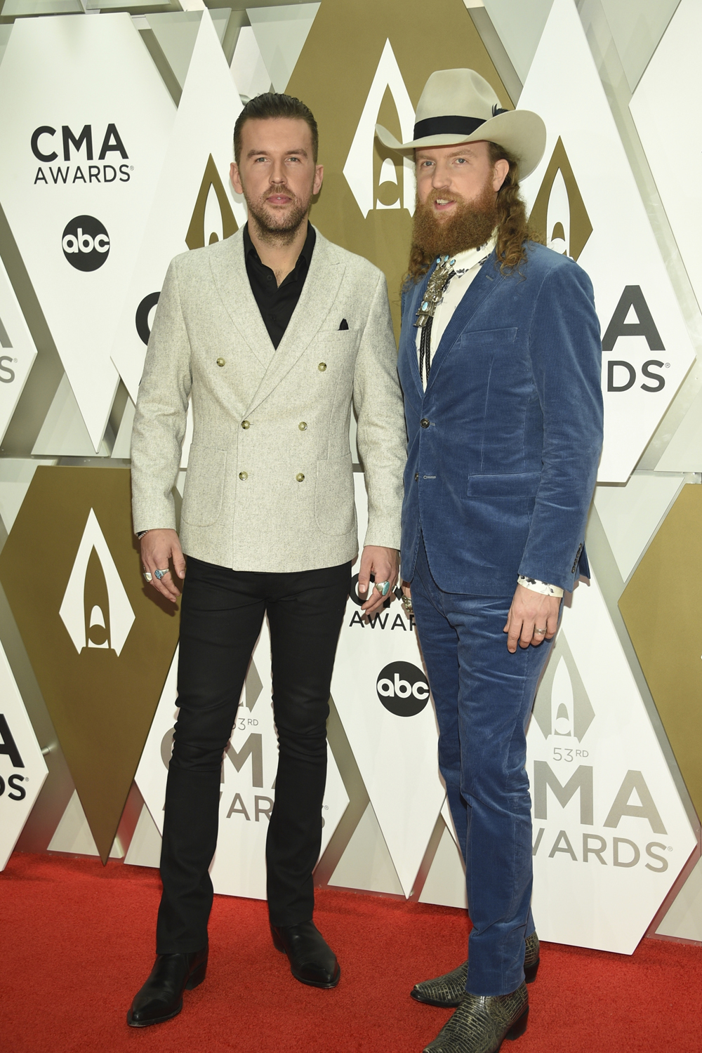 T.J. Osborne, left, and John Osborne, of Brothers Osborne arrive at the 53rd annual CMA Awards at Bridgestone Arena on Wednesday, Nov. 13, 2019, in Nashville, Tenn. (Photo by Evan Agostini/Invision/AP)