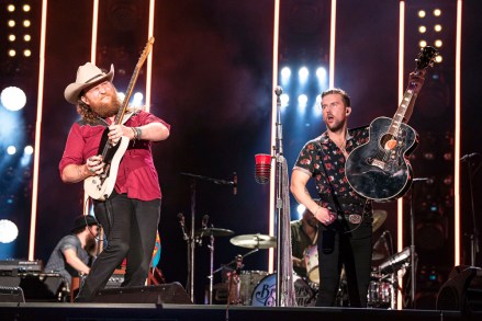 NASHVILLE, TENNESSEE - JUNE 06: John Osborne and T.J. Osborne of musical duo Brothers Osborne perform on stage during day 1 of 2019 CMA Music Festival on June 06, 2019 in Nashville, Tennessee. (Photo by imageSPACE/Sipa USA)(Sipa via AP Images)