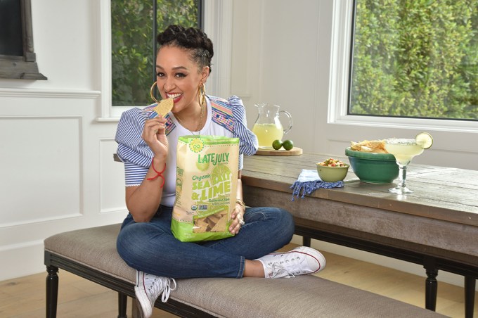 Tia Mowry Making Cocktails and Dip With a bag of Late July Organic Restaurant Tortilla Chips