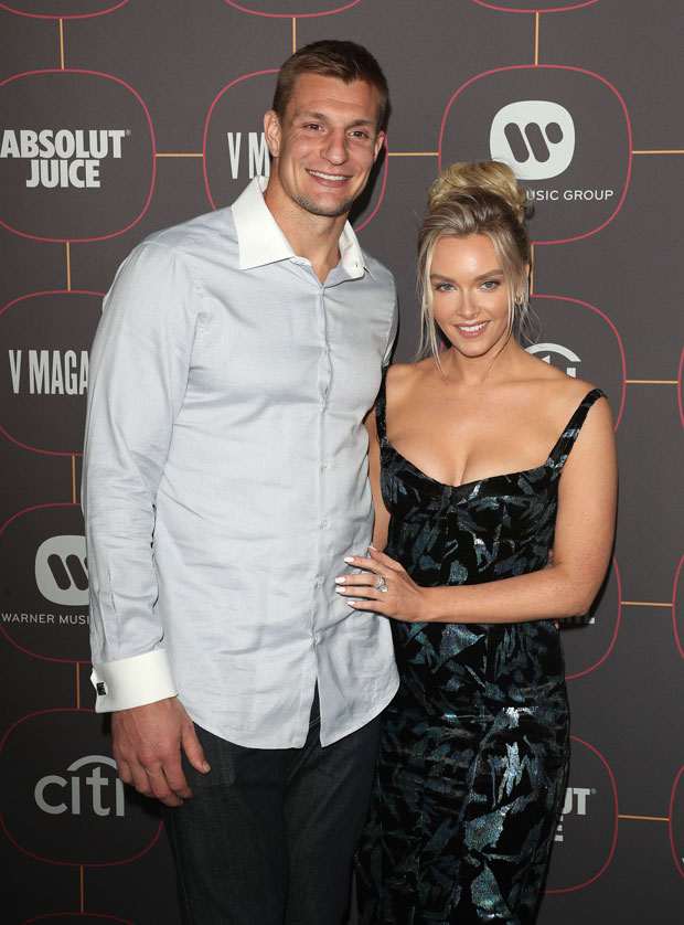 Ex-New England Patriots tight end Rob Gronkowski and his girlfriend, Camille  Kostek, are shown …