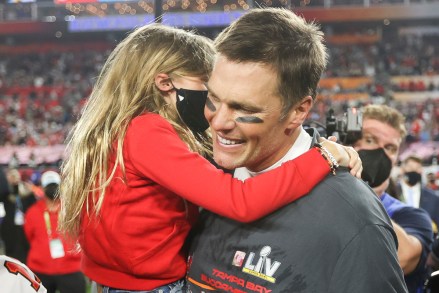 Tampa Bay Buccaneers quarterback Tom Brady (12) celebrates with his family following the NFL Super Bowl 55 football game against the Kansas City Chiefs, Sunday, Feb. 7, 2021 in Tampa, Fla. Tampa Bay won 31-9 to win Super Bowl LV. (Ben Liebenberg via AP)
