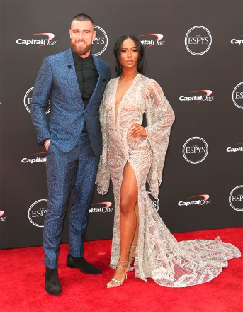 Kansas City Chiefs' Travis Kelce, left, and Kayla Nicole arrive at the ESPY Awards at the Microsoft Theater on Wednesday, July 18, 2018, in Los Angeles.  (Photo by Willy Sanjuan/Invision/AP)