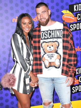 (L-R) Kayla Nicole and Travis Kelce arrives at the Nickelodeon's Kids' Choice Sports 2018 held at the Barker Hangar in Santa Monica, CA on Thursday, July 19, 2018. (Photo By Sthanlee B. Mirador/Sipa USA)(Sipa via AP Images)