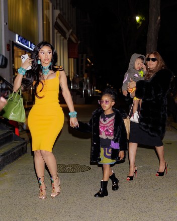 New York, NY  - *EXCLUSIVE*  - Cardi B, rapper, shines in a yellow dress with her adorable kids and her mother at Cipriani Downtown. She even later posted on Instagram, 